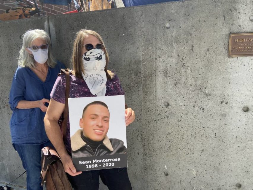 Gretchen Zimmerman holds an image of Sean Monterrosa