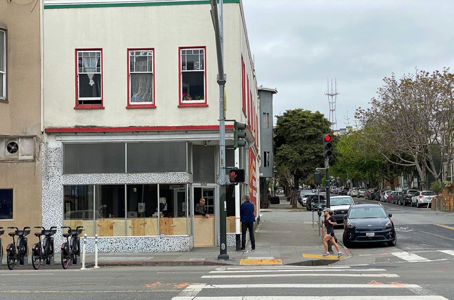 Rory Lydon at his Lucca door talking to someone on the street.