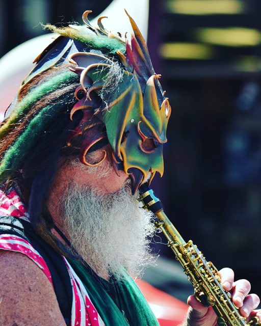 On a flute and mask.Band at protest