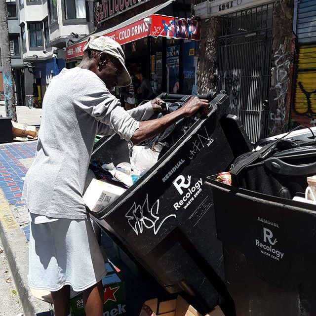 Thomasa Duarte looking through garbage on 15th Street