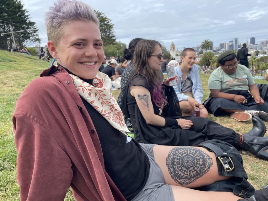 Jenna Kahn showing their favourite tattoo.