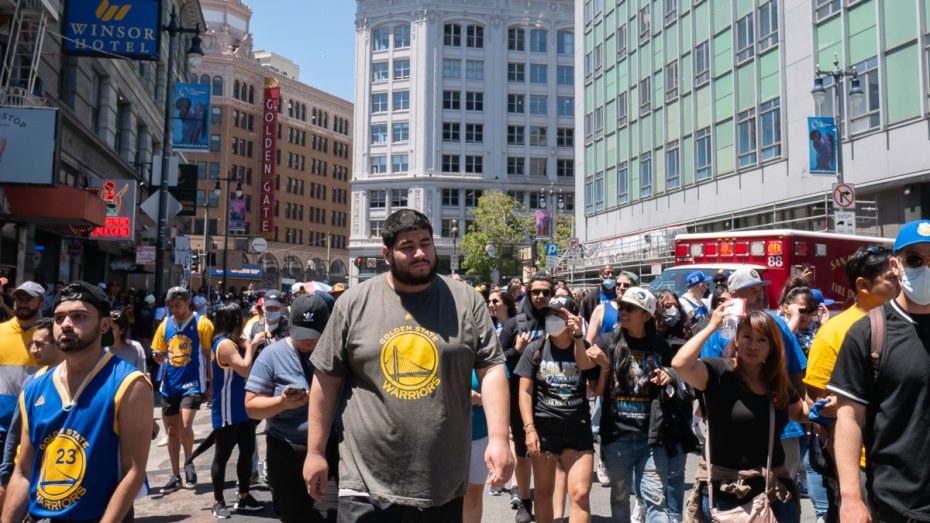 Warriors fans leave after the parade finishes