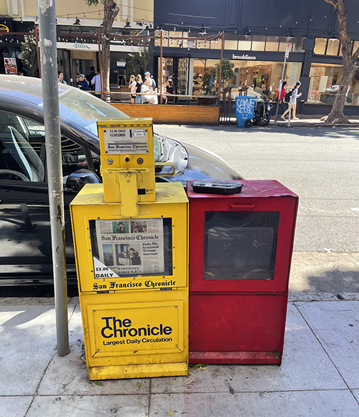 A yellow Chronicle newsrack