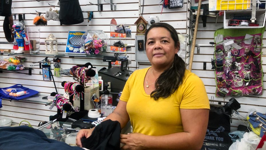 Brindissy Garcia stands behind the counter of the Pikitos, her own thrift shop.
