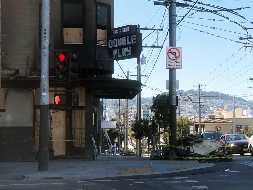 A photo of double play, a bar with boarded up windows