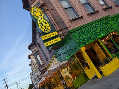 Exterior of a yellow and green building.