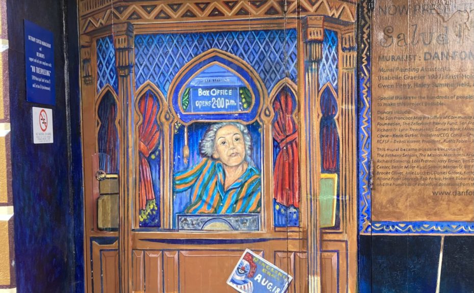 Mural of a woman at a ticket booth.