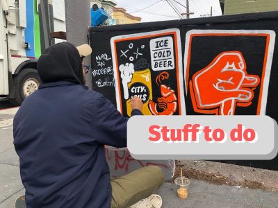 Max Martilla painting a mural