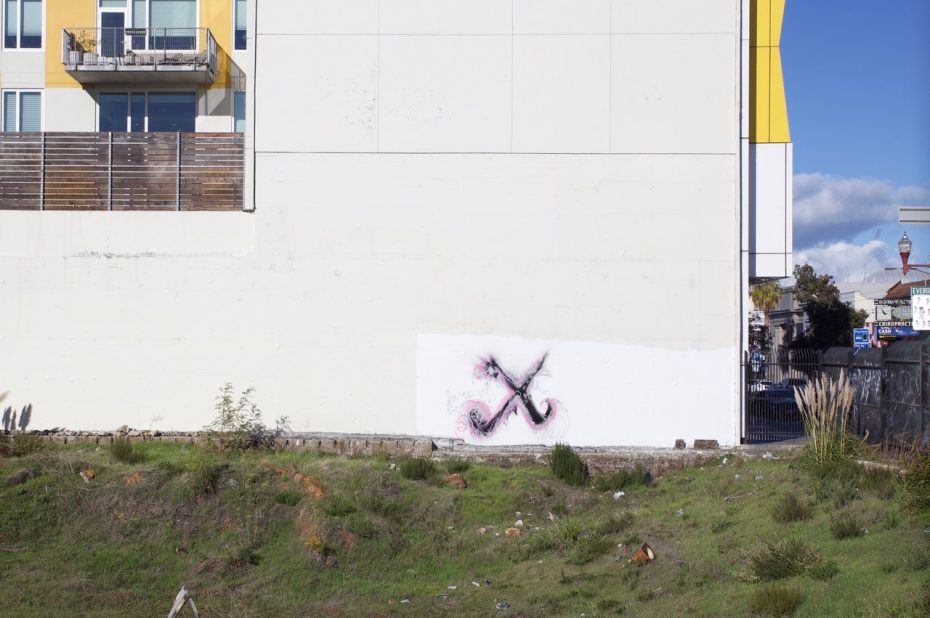 A balcony, a blank wall, an X written on it.