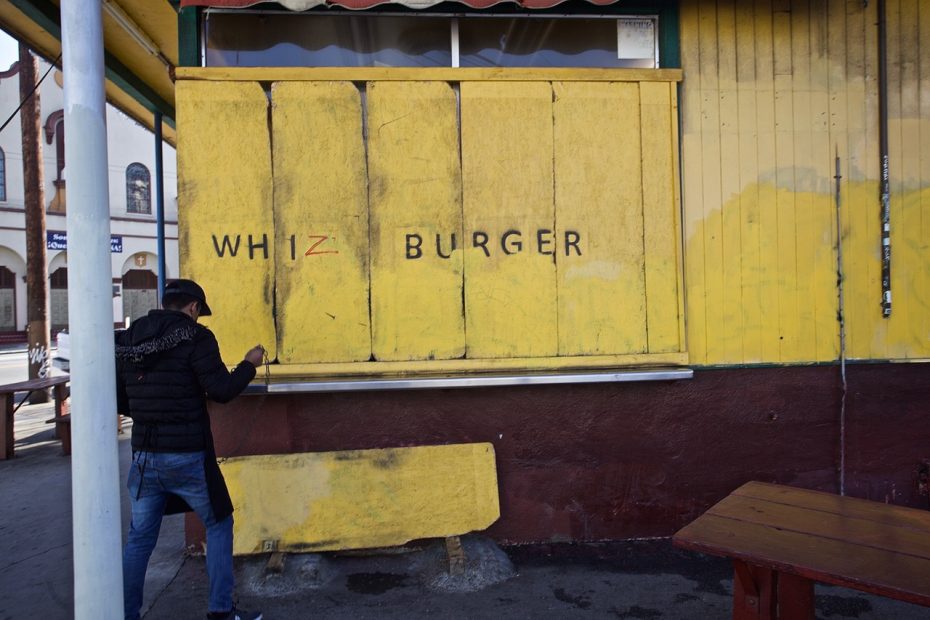 A yellow wall with Whiz written on it.