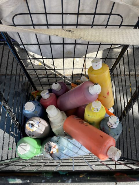 Shopping cart of paints.