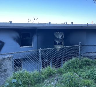 blackened and burnt windows in Potrero Hill public housing
