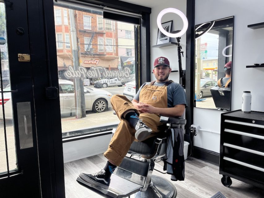Man sitting in barber chair