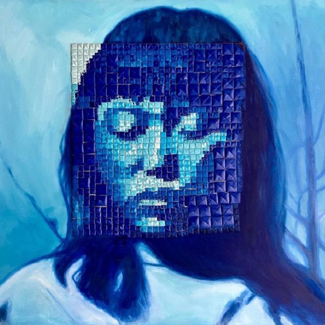A blue face of a woman.