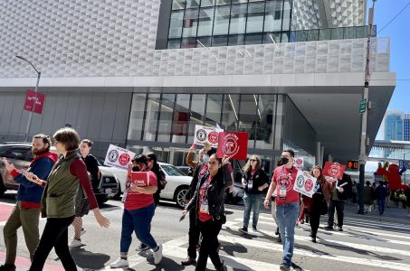 A group of people crossing the street