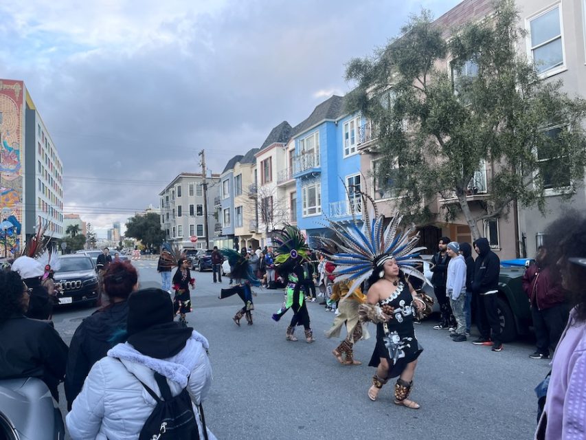 People dance in street