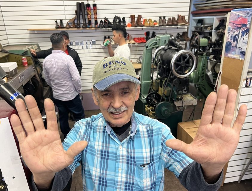 A man showing his two palms.