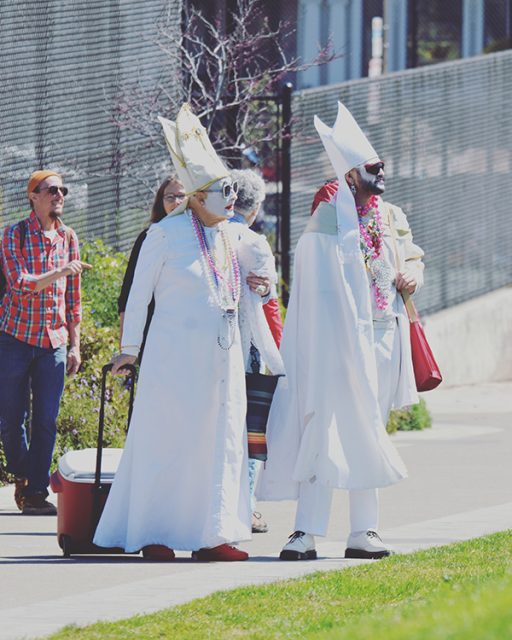 Two people dressed as bishops for Easter.
