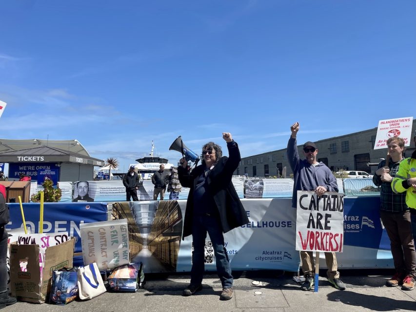 A person is speaking with a megaphone.
