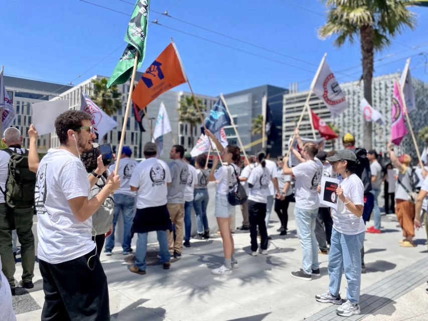 A large group of people holding flags