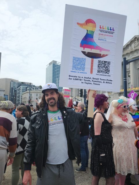 Texan marcher Kevin Lindsey advocating for cross-state solidarity outside City Hall.