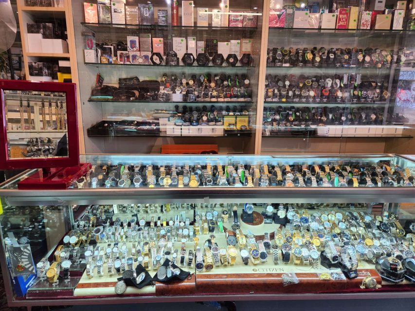 metal watches in a glass shelf