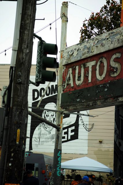 Auto sign, doomsday on wall, traffic light.
