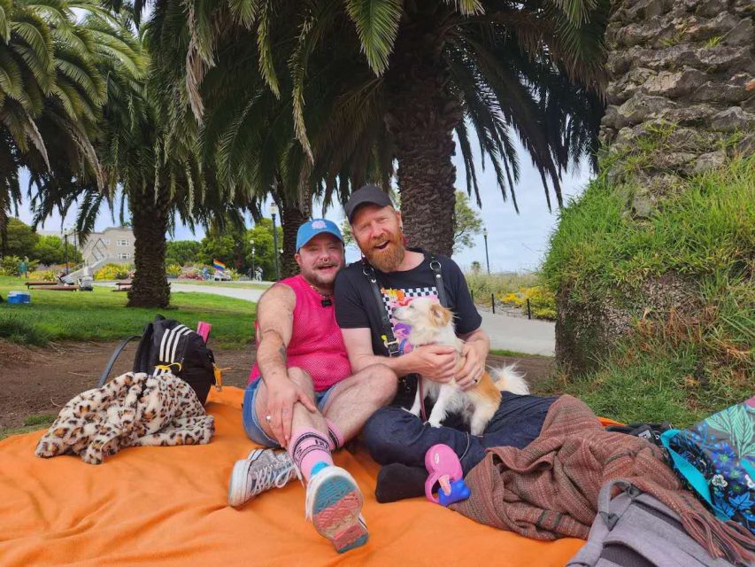 two people and a dog