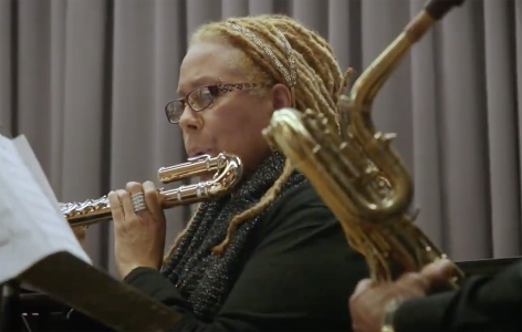 A woman playing the flute.