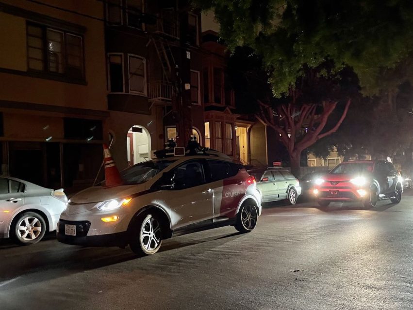 A vehicle with a cone on its front hood
