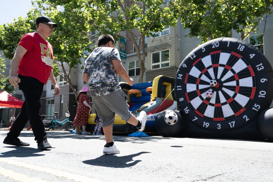 A roulette wheel and two pedestrians.