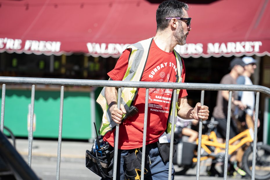 A volunteer working at Sunday Streets.