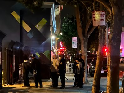 teenagers held zip tied behind their backs on a sidewalk late at night