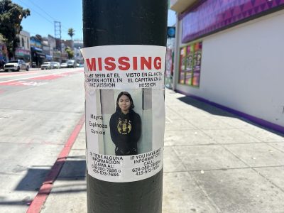 A flyer of a missing child, Mayra Espinoza. The flyer features an image of the young girl in a Warriors hoodie, and contact information for those who have leads on her whereabouts.