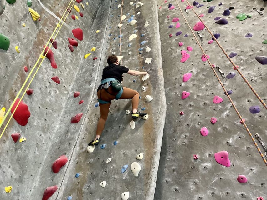 A person climbing in a gym