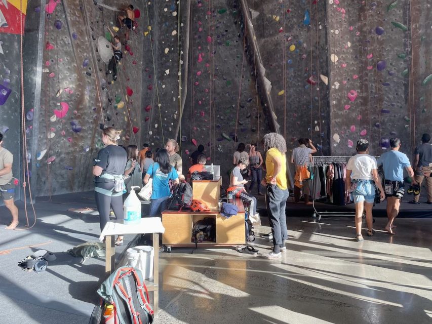 A group of people climbing in a gym