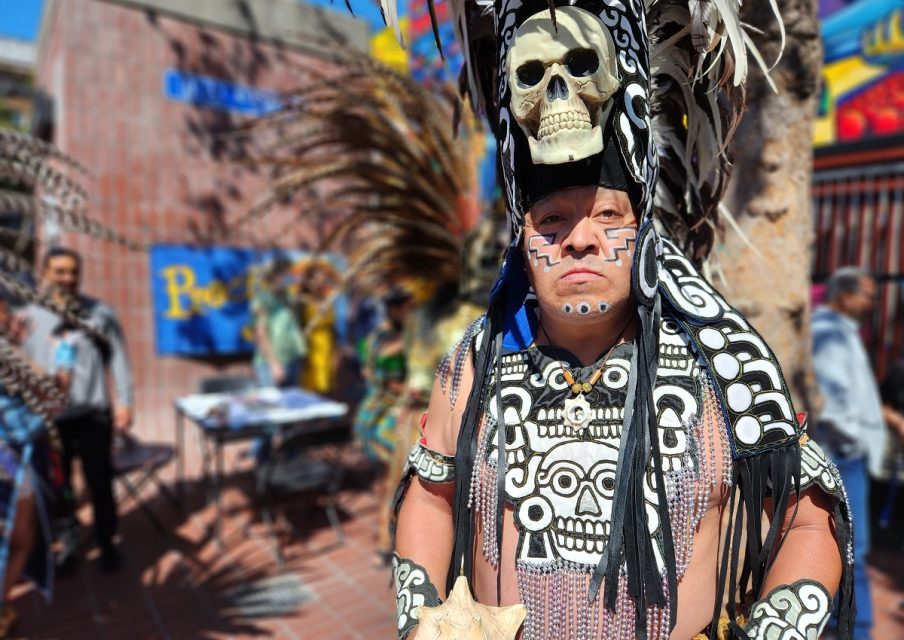 A traditional dancer on the 24th and Mission plaza.