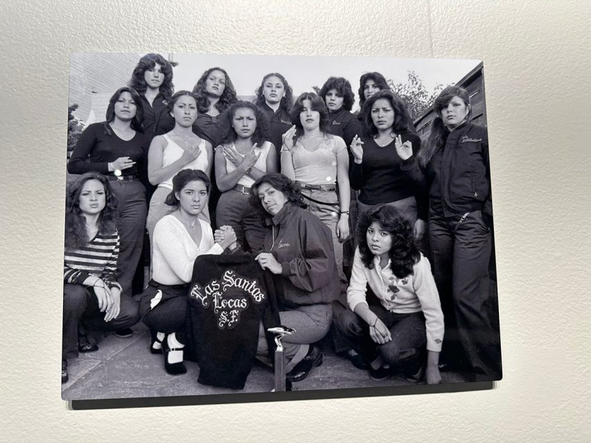 A group of women with two holding a Las Santos Locas SF T-shirt