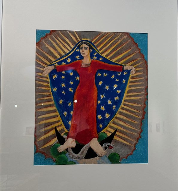 A blue cold and red Virgin of the Guadalupe.