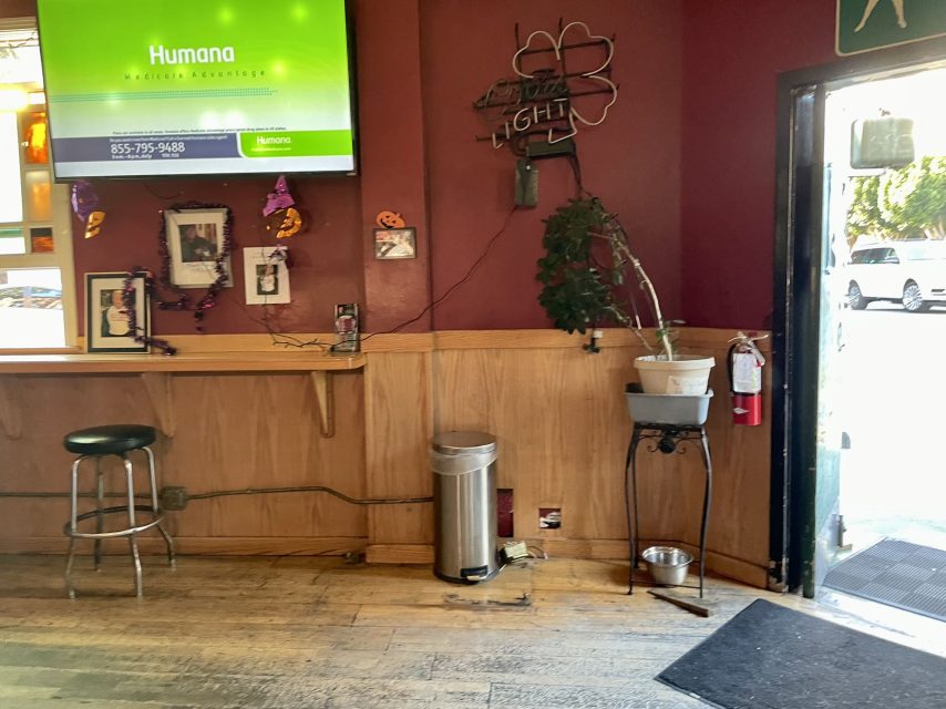 The entrance to Clooney's Pub with a tv on the wall.