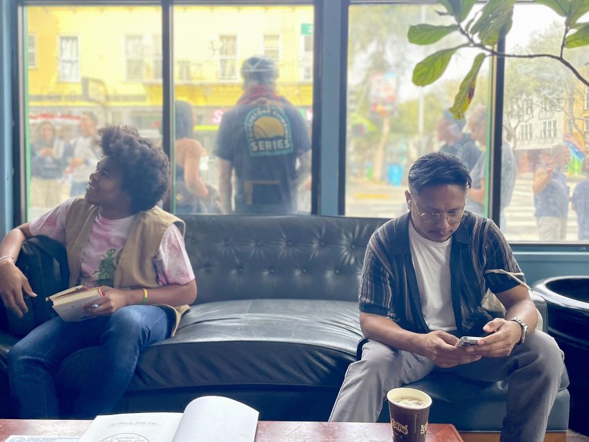 Two men sitting on a couch at Philz.