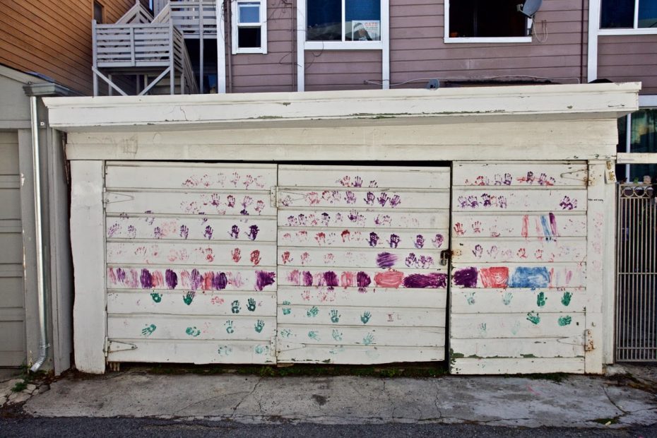colorful handprints on a garage door