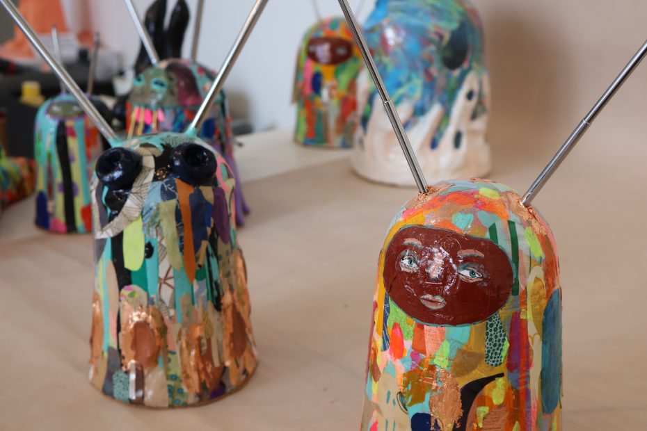 A group of colorful vases on a table.