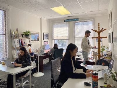 A group of reporters working at the Mission Local newsroom