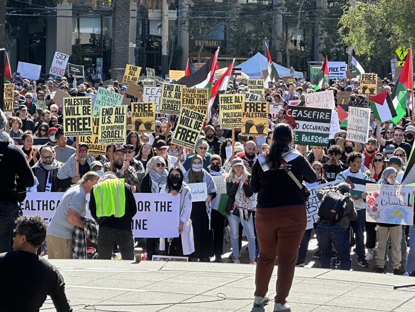 Violette Mansour speaking in front of thousands of protesters calling on an end to the siege in Gaza.