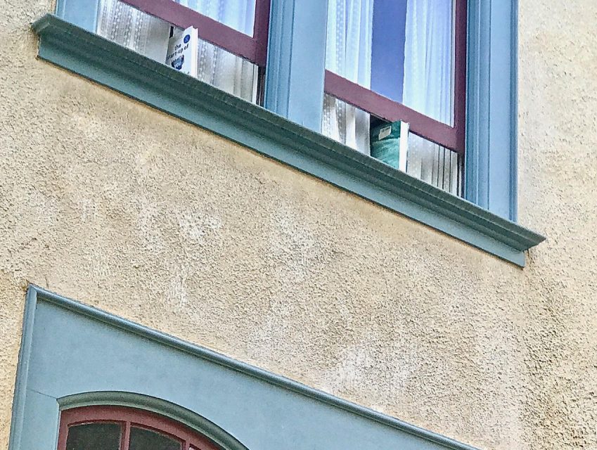 Two books in a window.