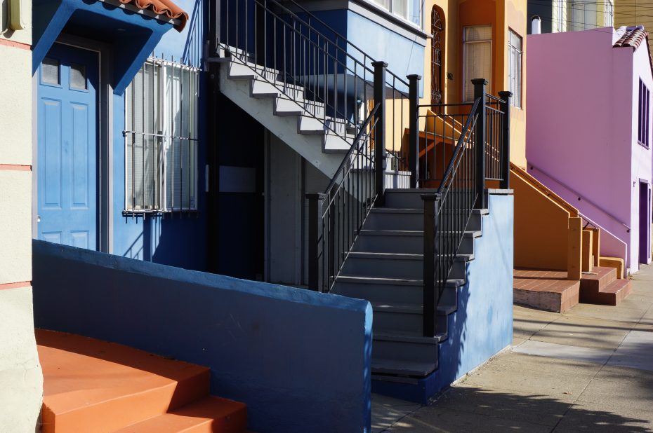 A row of colorful houses on a street in san francisco, california.