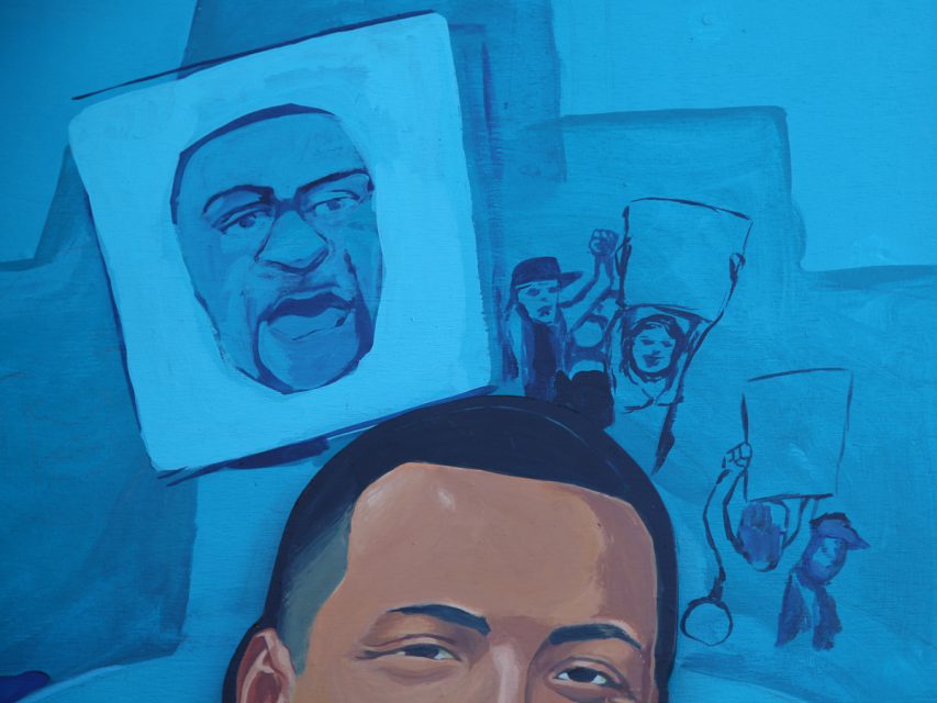 mural detail of the BLM movement and the eyes of Sean Monterrosa.