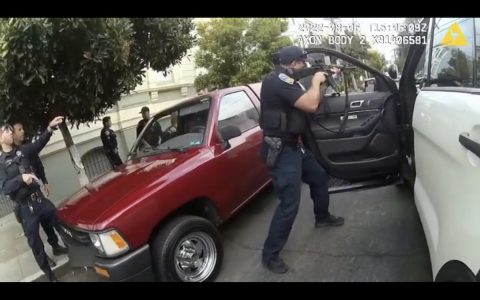 San francisco police officer tries to stop a car in san francisco.