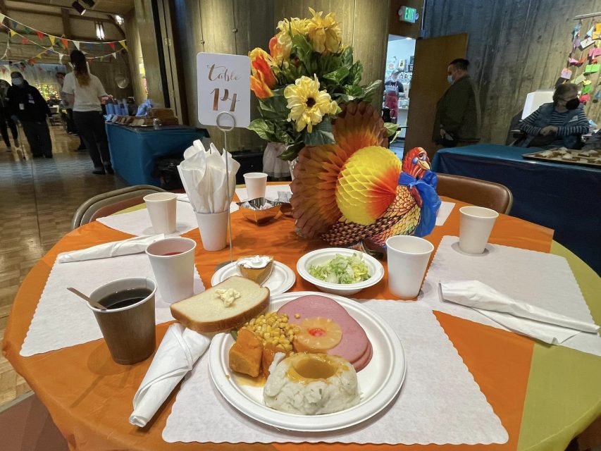 A table with food and a turkey on it.